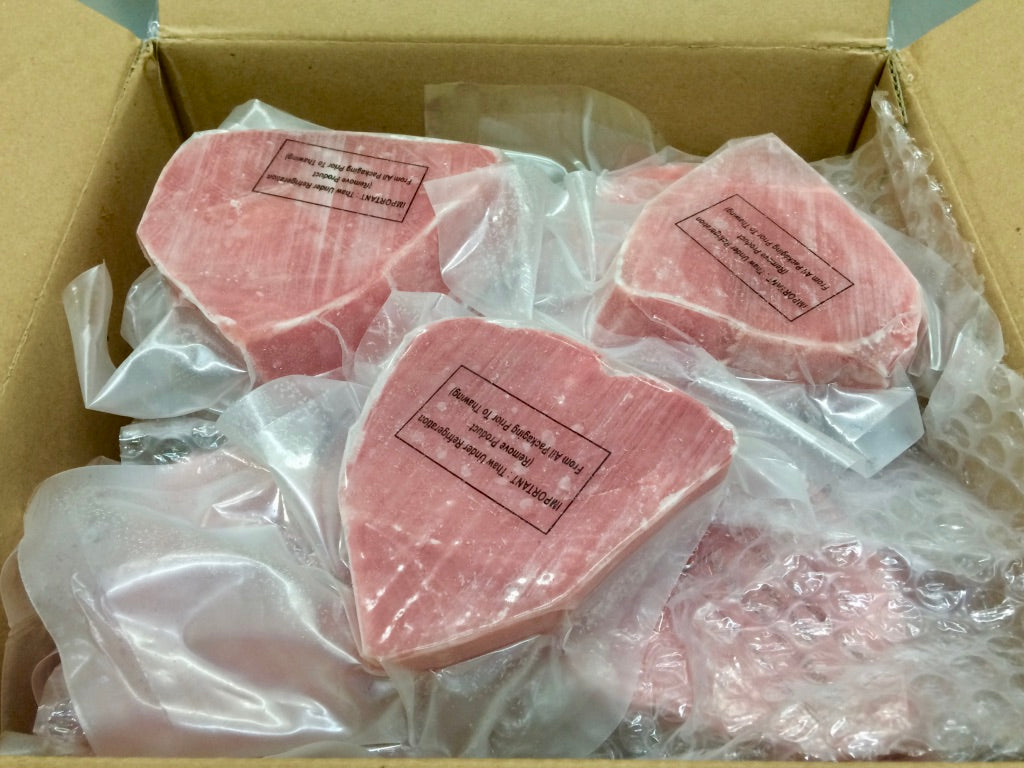 Oyster Bay Individual Vacuum Packed Skinless Boneless Wild 4 Ounce Tuna Steak 10 Pound Each - 1 Per Case.