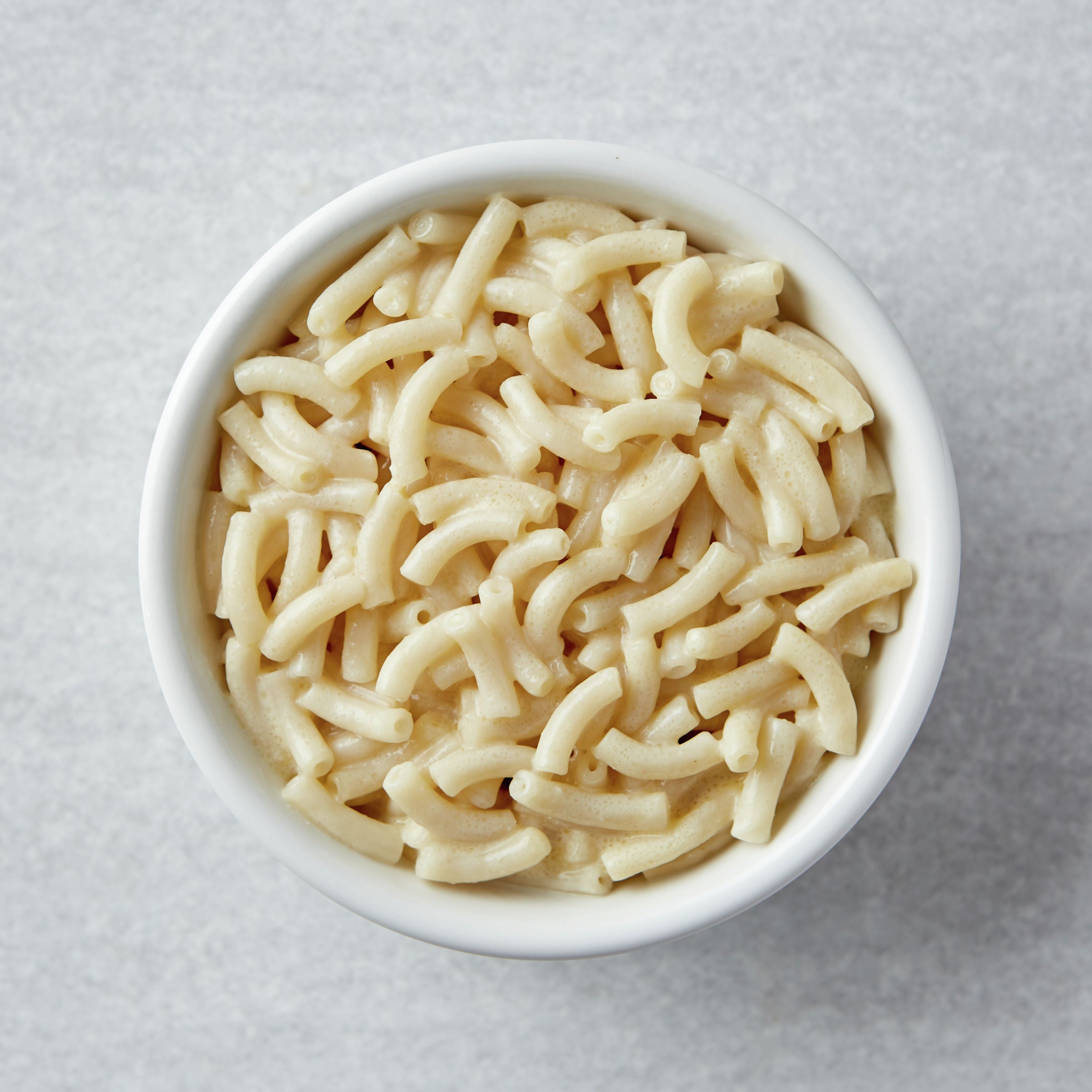 Annie's™ Macaroni & Cheese Microwave Single Serve Cup White Cheddar 2.01 Ounce Size - 12 Per Case.