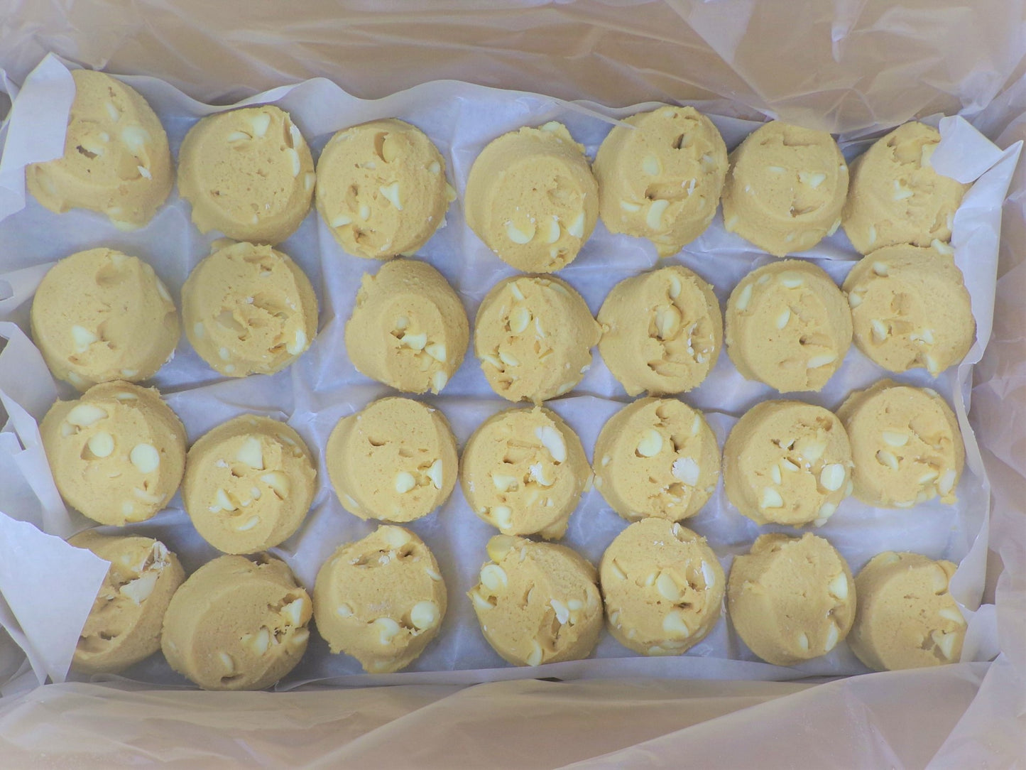 Aphrodite Divine Confections Macadamia Nut White Chocolate Cookie 2 Ounce Size - 84 Per Case.