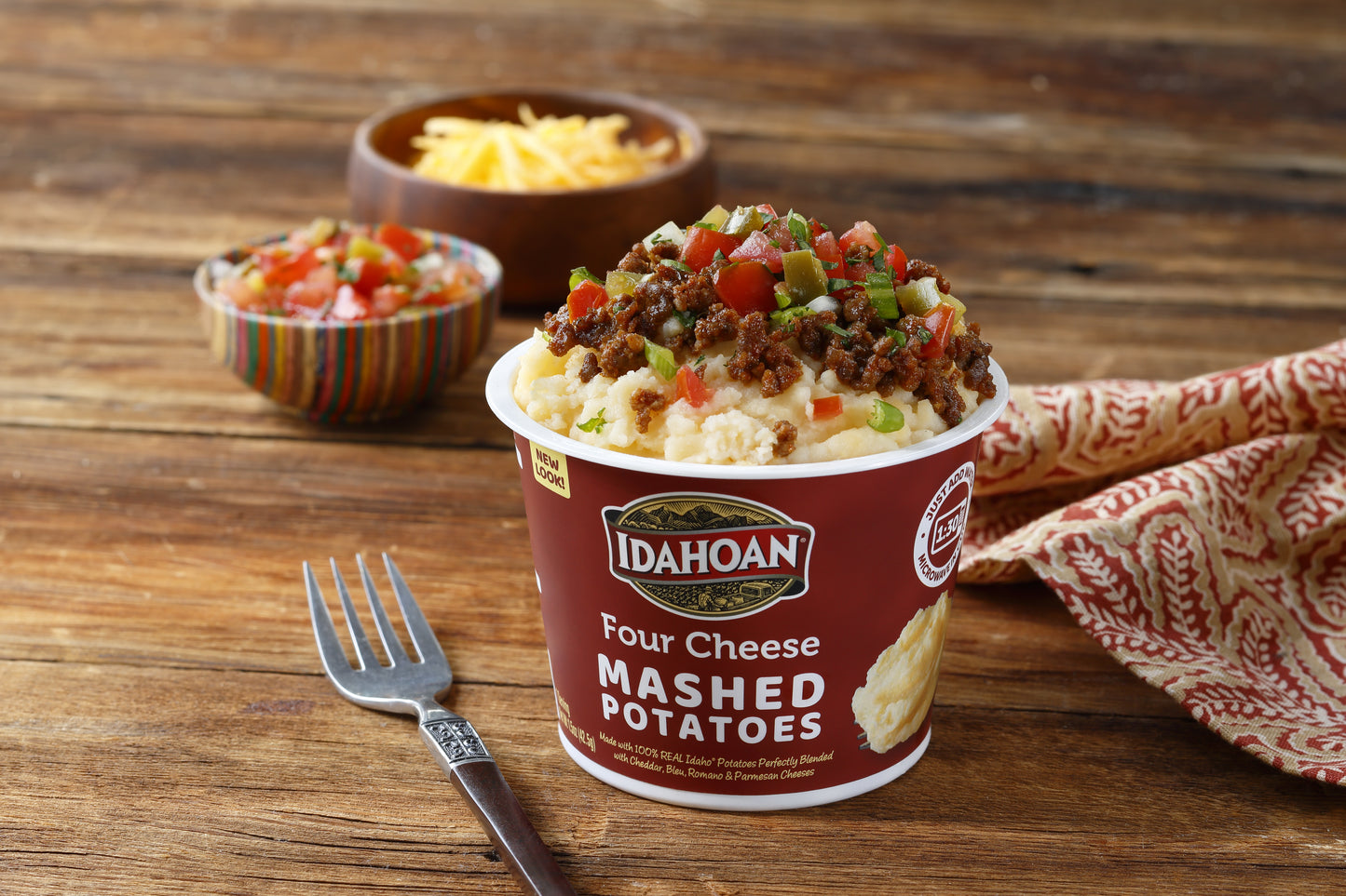 Idahoan Foods Four Cheese Mashed Cup 1.5 Ounce Size - 10 Per Case.